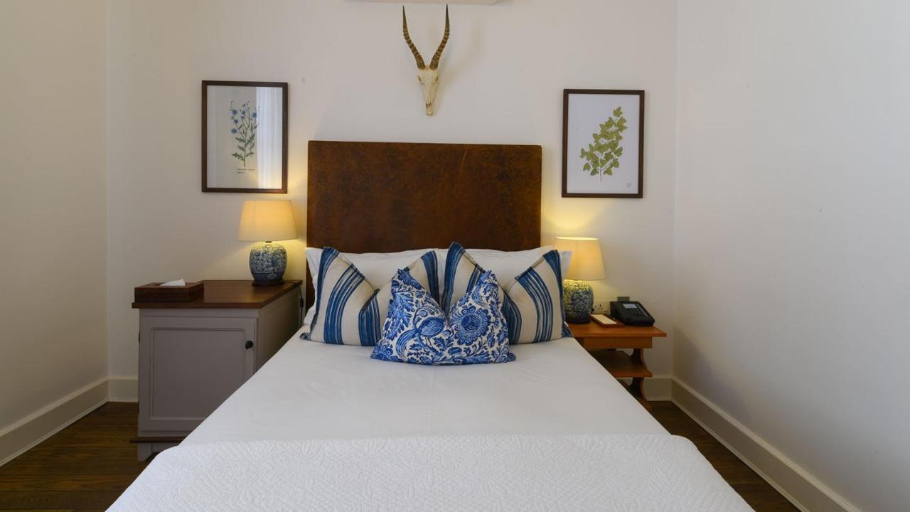 Drostdy Hotel Graaff Reinet Exterior photo A bedroom at the hotel