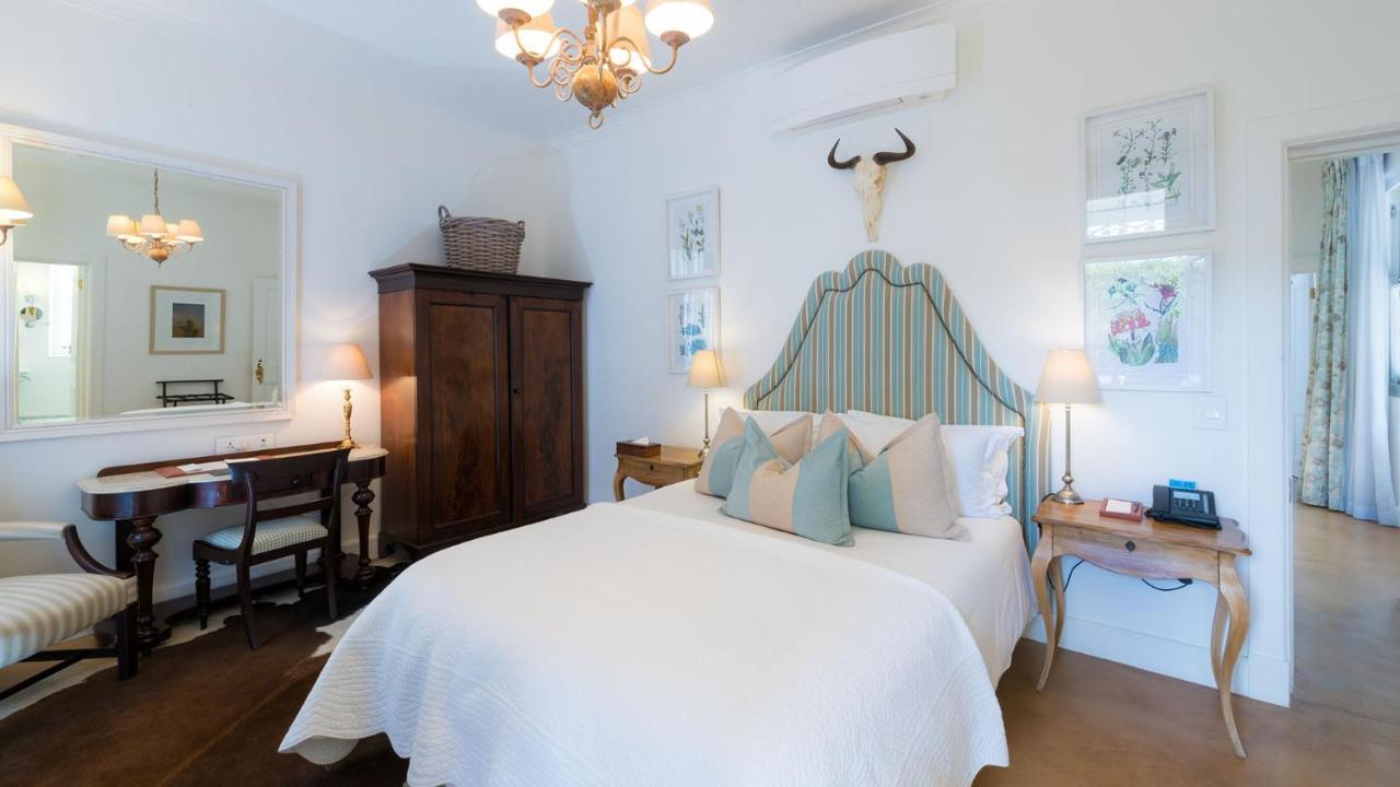 Drostdy Hotel Graaff Reinet Exterior photo A bedroom at the Cape Heritage