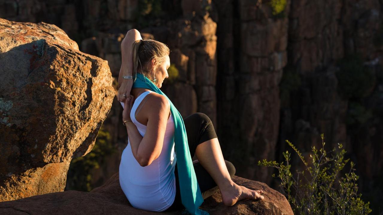Drostdy Hotel Graaff Reinet Exterior photo A woman practicing yoga