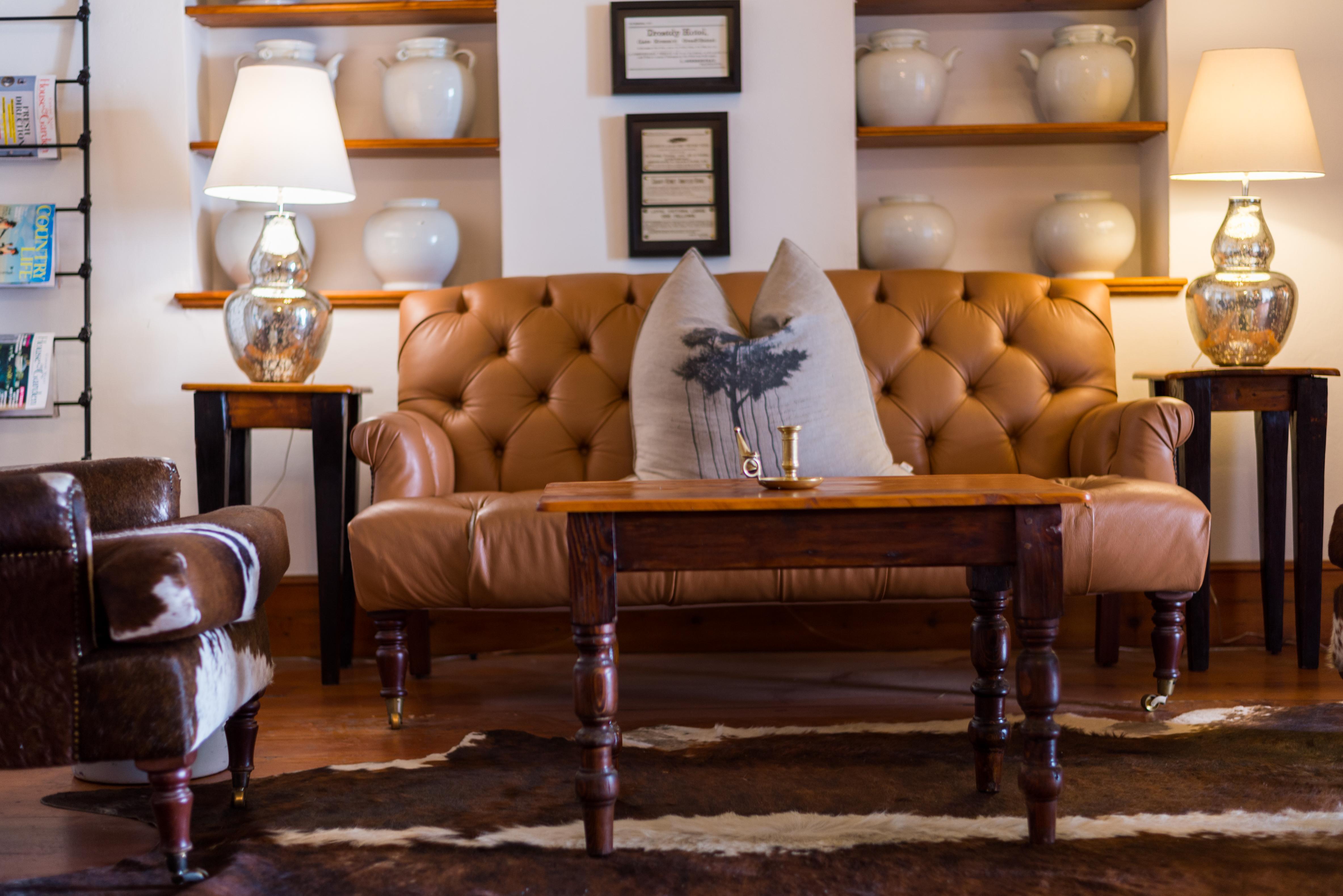 Drostdy Hotel Graaff Reinet Exterior photo A leather sofa